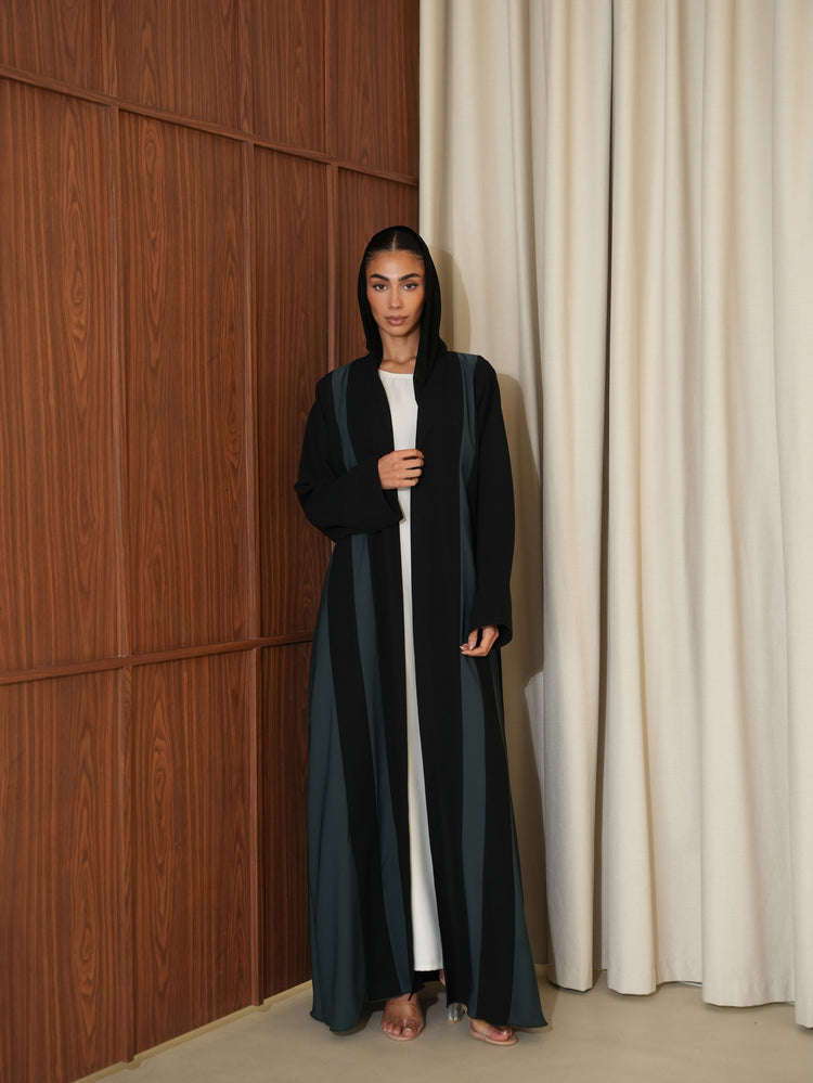 Front view of a two-tone abaya with dark contrasting vertical panels